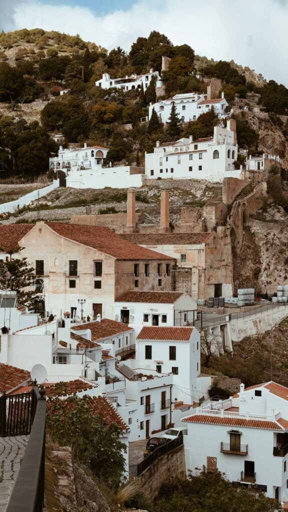 Explore the picturesque whitewashed streets and hilltop views of Frigiliana, Spain.